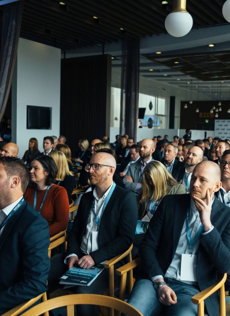 Conference audience listening during a summit